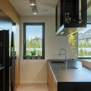 Modern White Kitchen With A Black Island